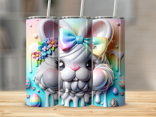 Three pastel Easter bunny tumblers with colorful drip details and bows.