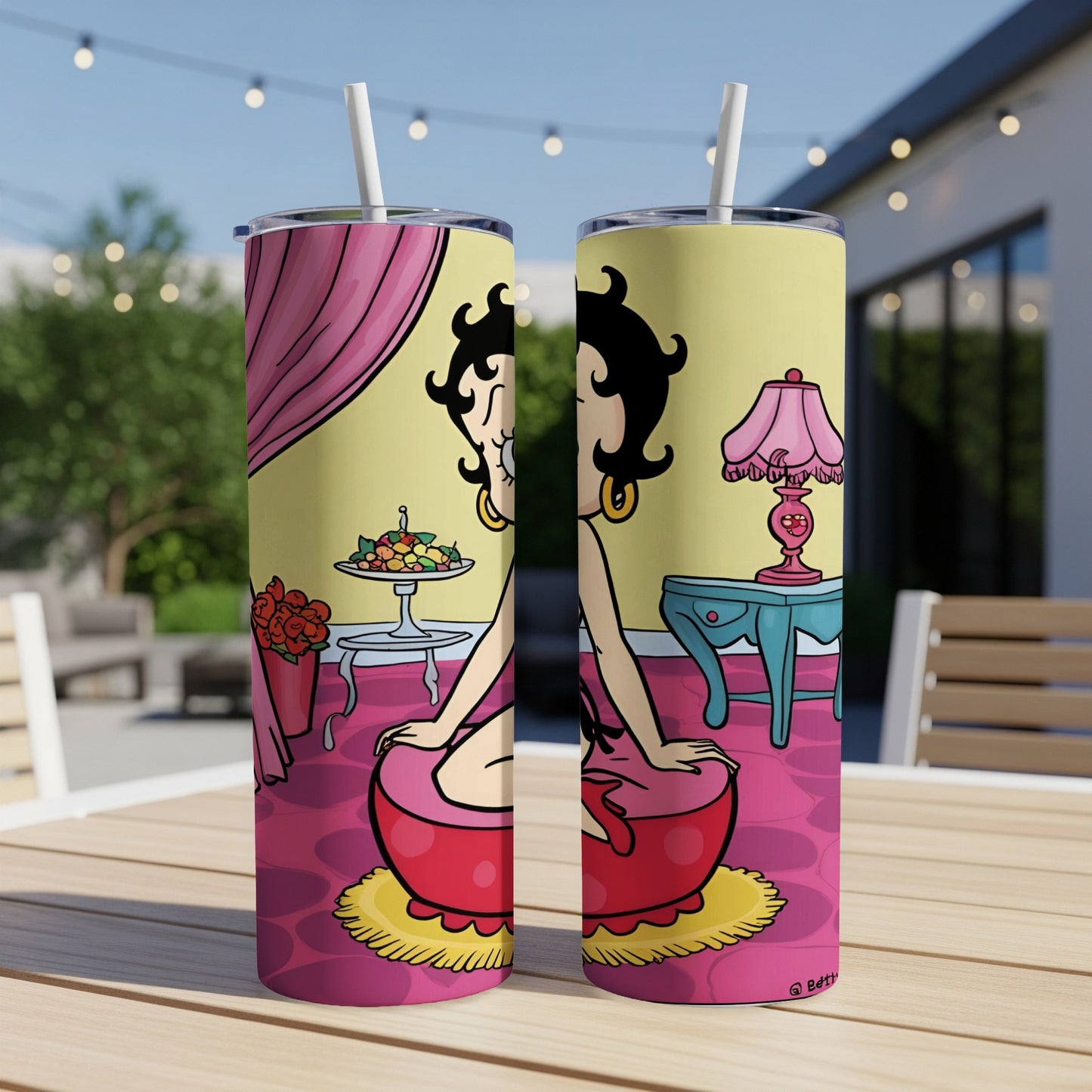 Betty Boop in red outfit on a pink rug, with pink lamp and flowers.