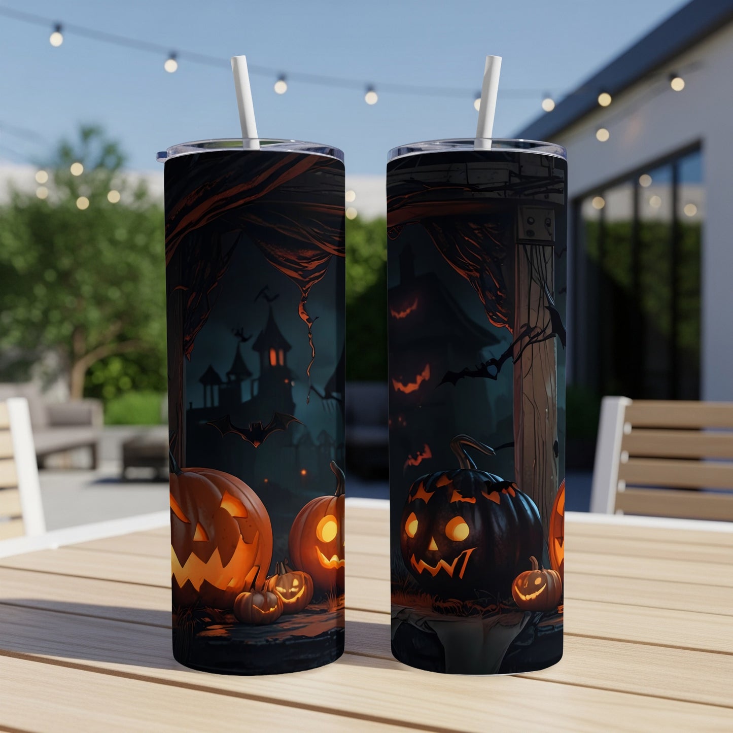 Two Halloween-themed tumblers with jack-o'-lanterns and a haunted castle design.