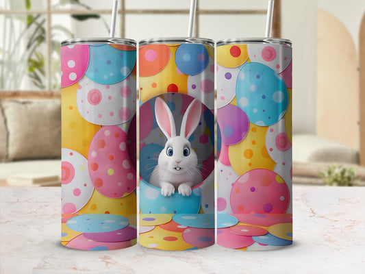 Easter bunny in colorful polka dot egg cup with pastel Easter eggs.