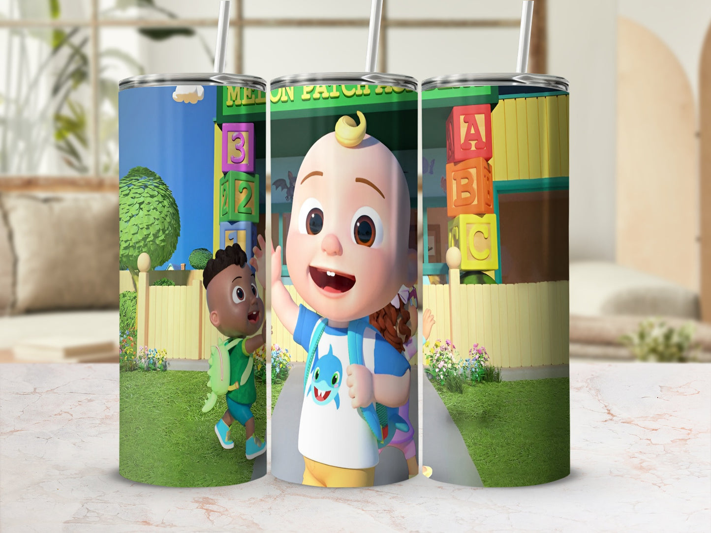 Cocomelon tumbler with cartoon characters and ABC blocks.