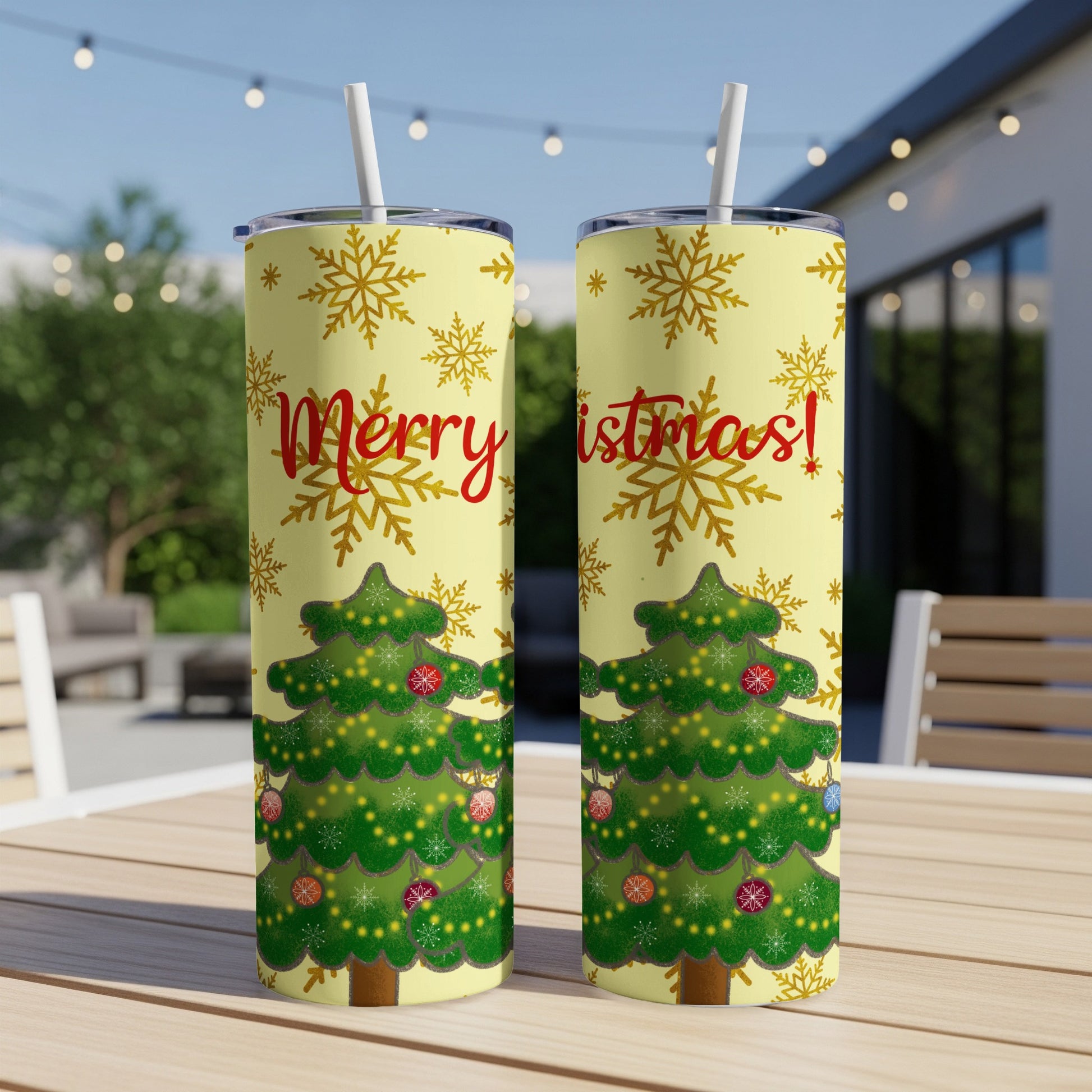Two tall tumblers with Christmas trees and "Merry Christmas" text on a yellow background.