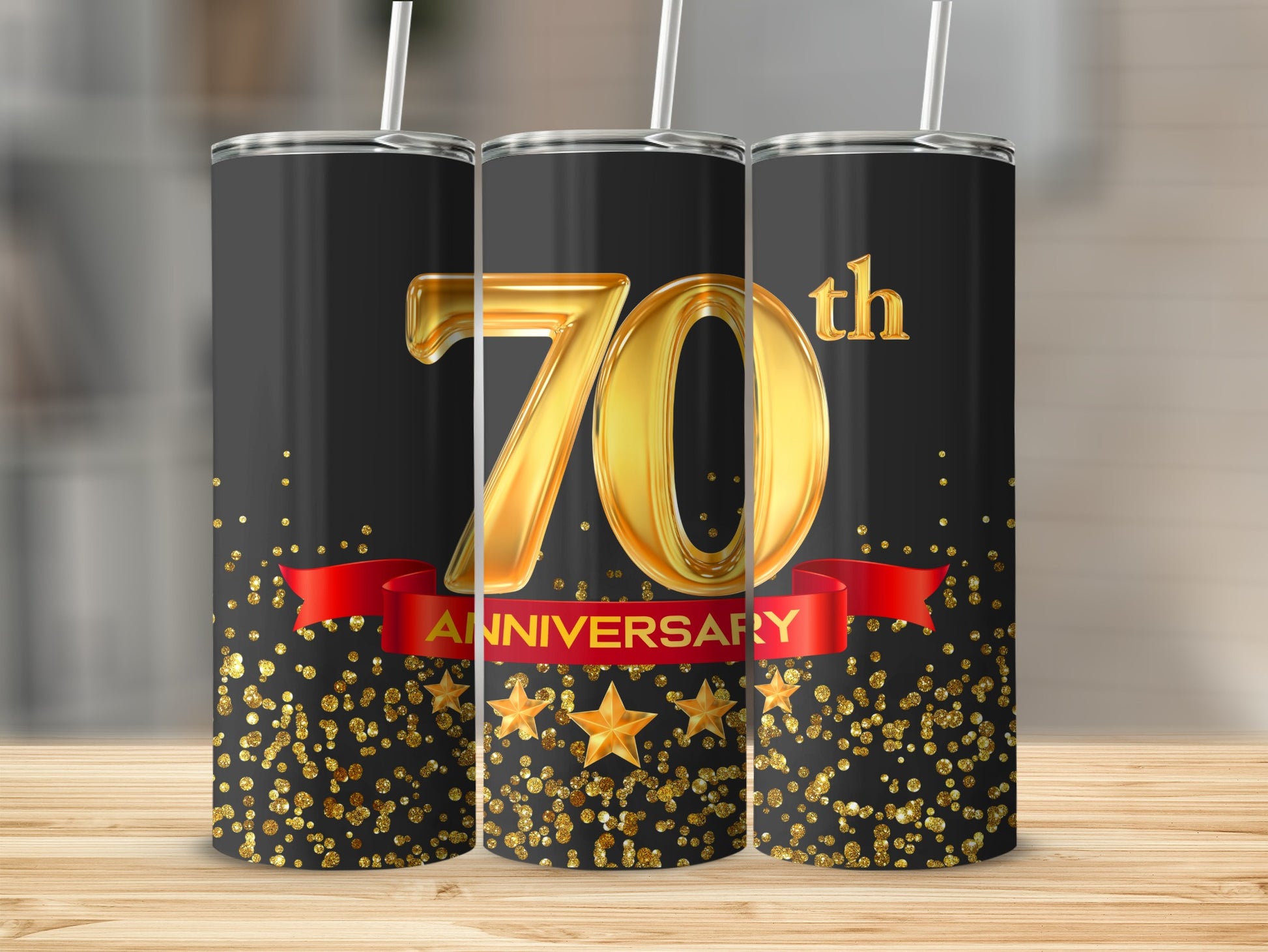 "70th Anniversary" text on a black tumbler with gold ribbon and glitter.