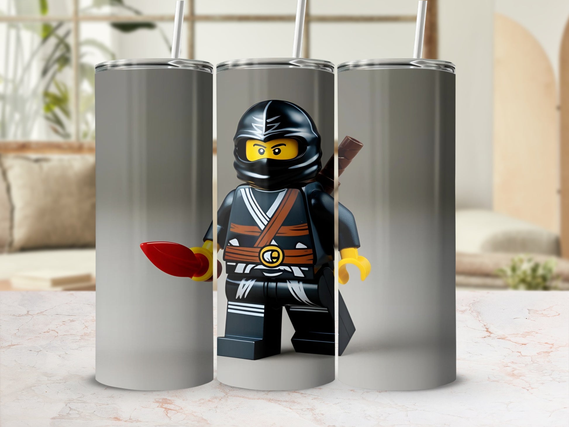 Lego ninja figure with red sword on a stainless steel tumbler.