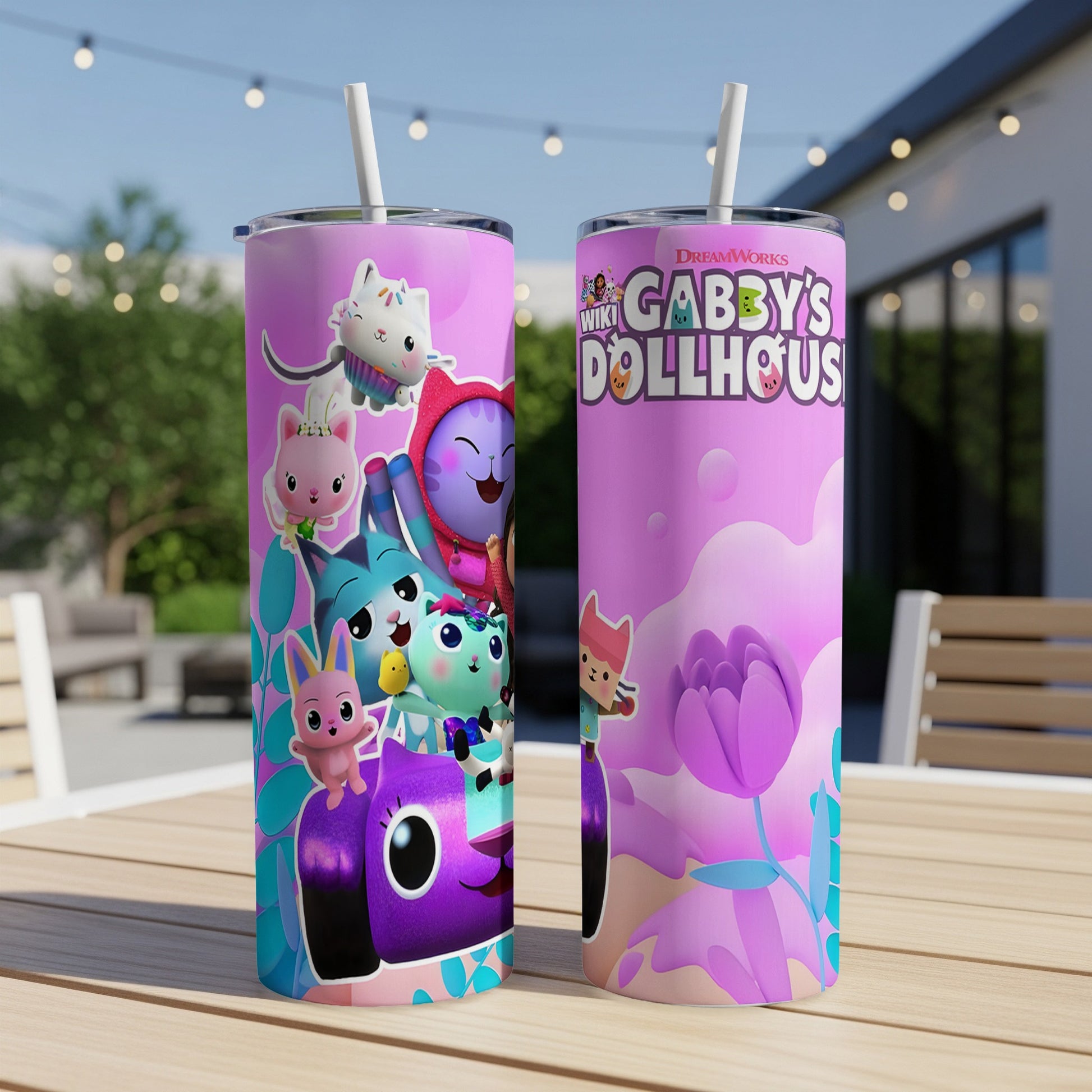 Gabby's Dollhouse tumbler with characters and floral design.