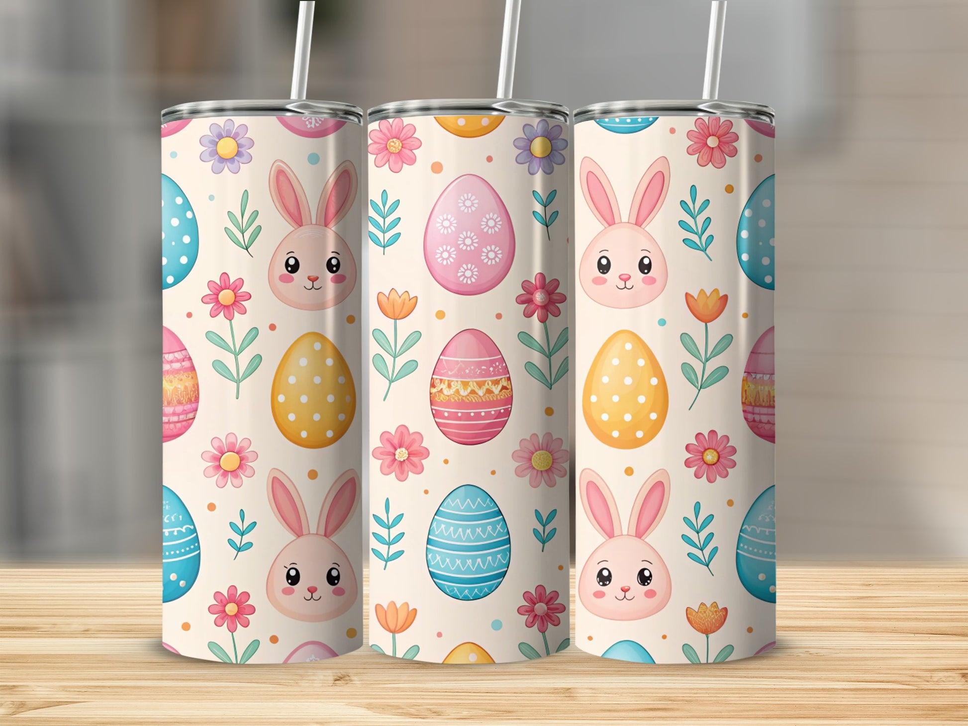 Easter bunny and egg pattern on three tumblers with straws.