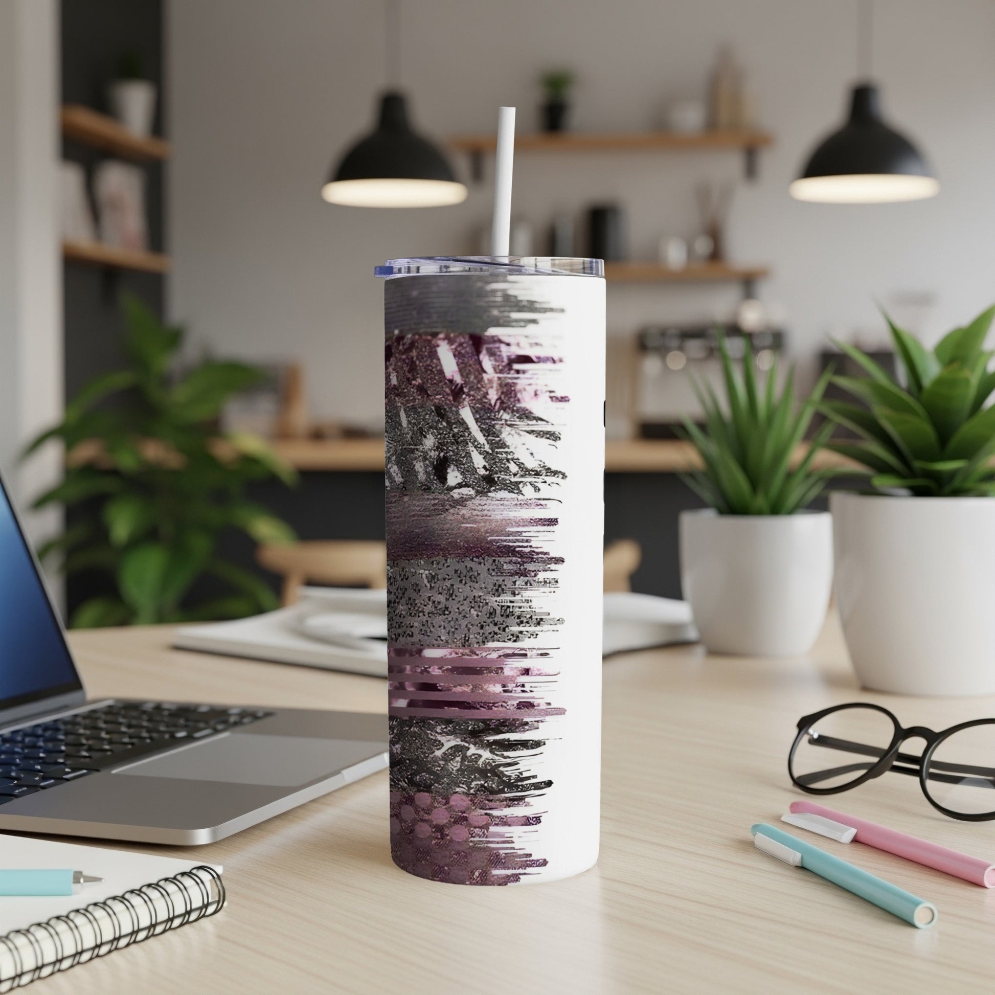 White tumbler with purple glitter and black abstract brushstroke design.