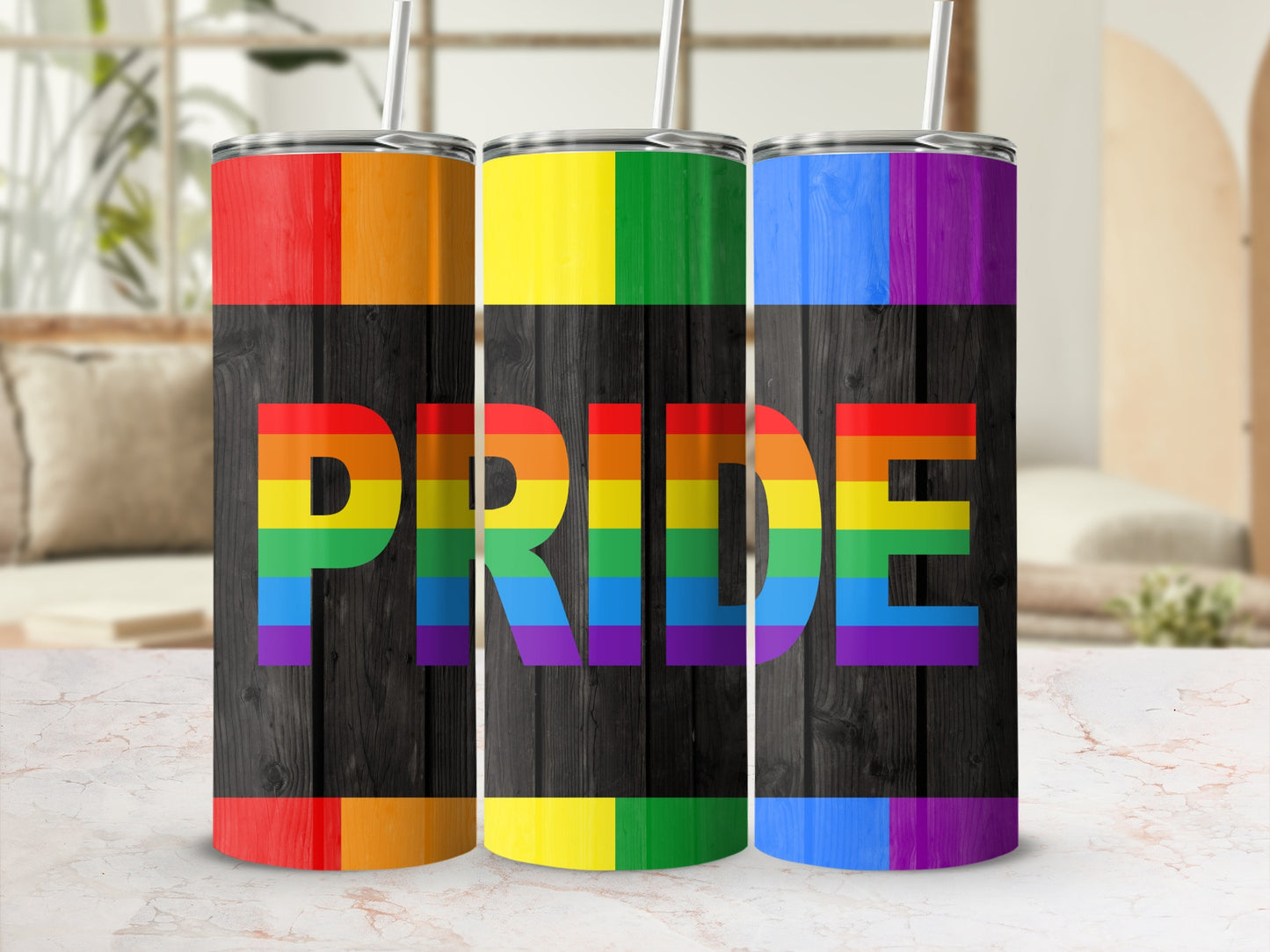 Pride tumbler with rainbow stripe design on wooden background.