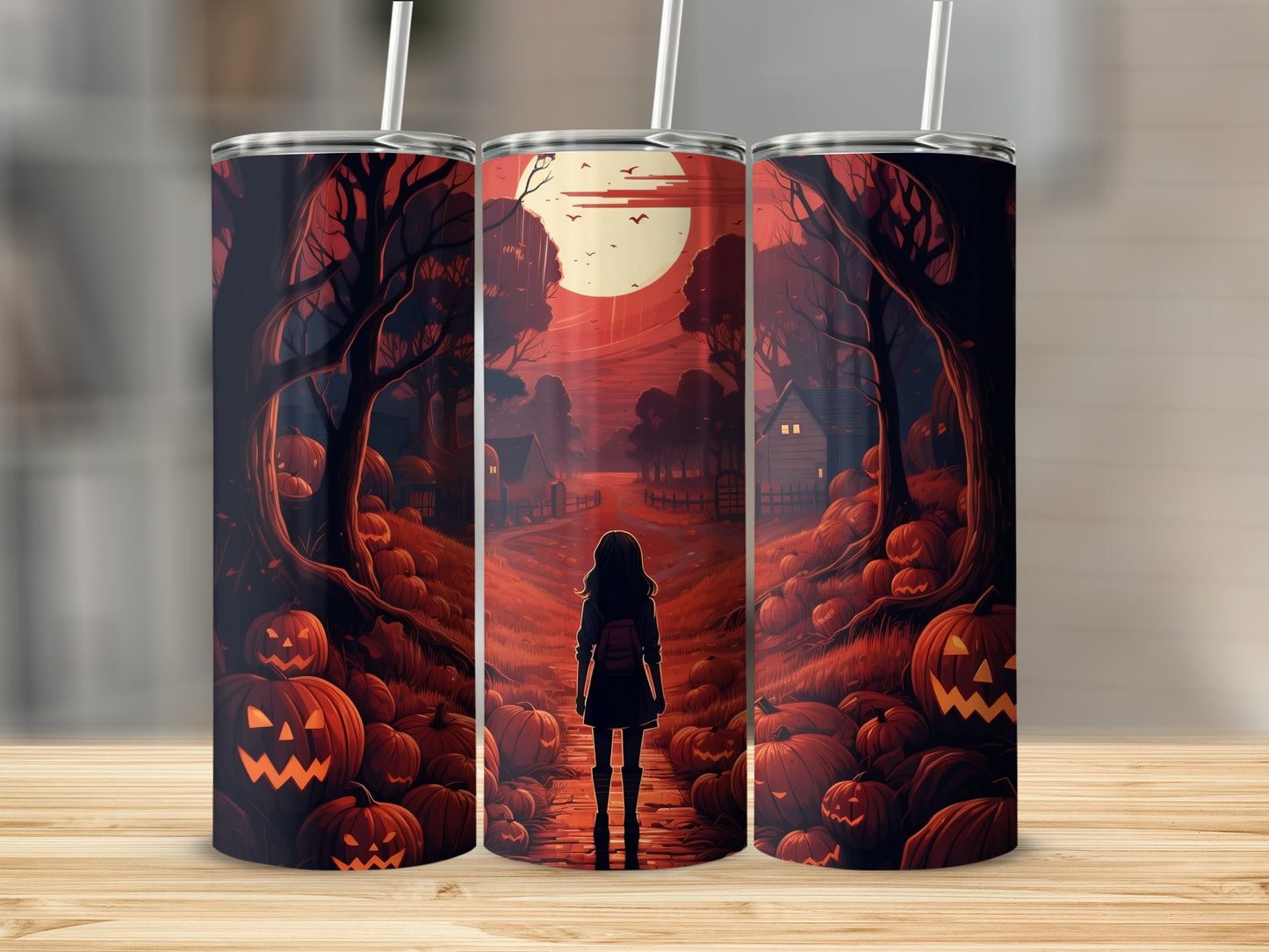 Three tumblers with a Halloween scene of a girl in a pumpkin patch under a full moon.