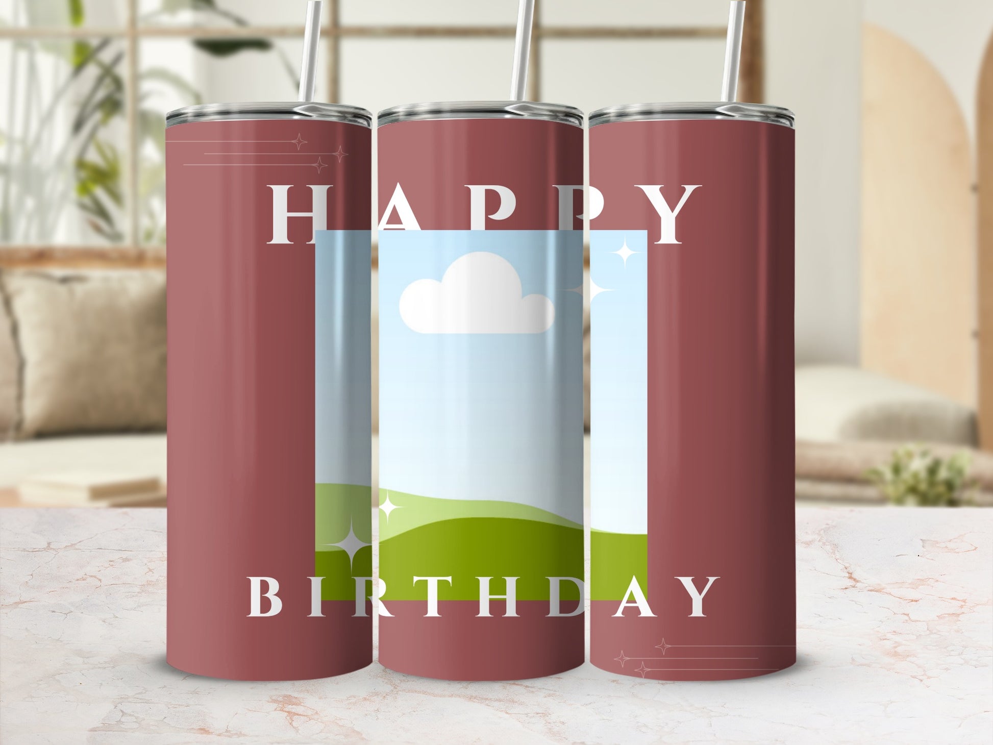 Three tumblers with "Happy Birthday" text, green hills, and blue sky.