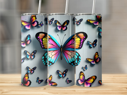 Three tumblers decorated with colorful butterfly designs.