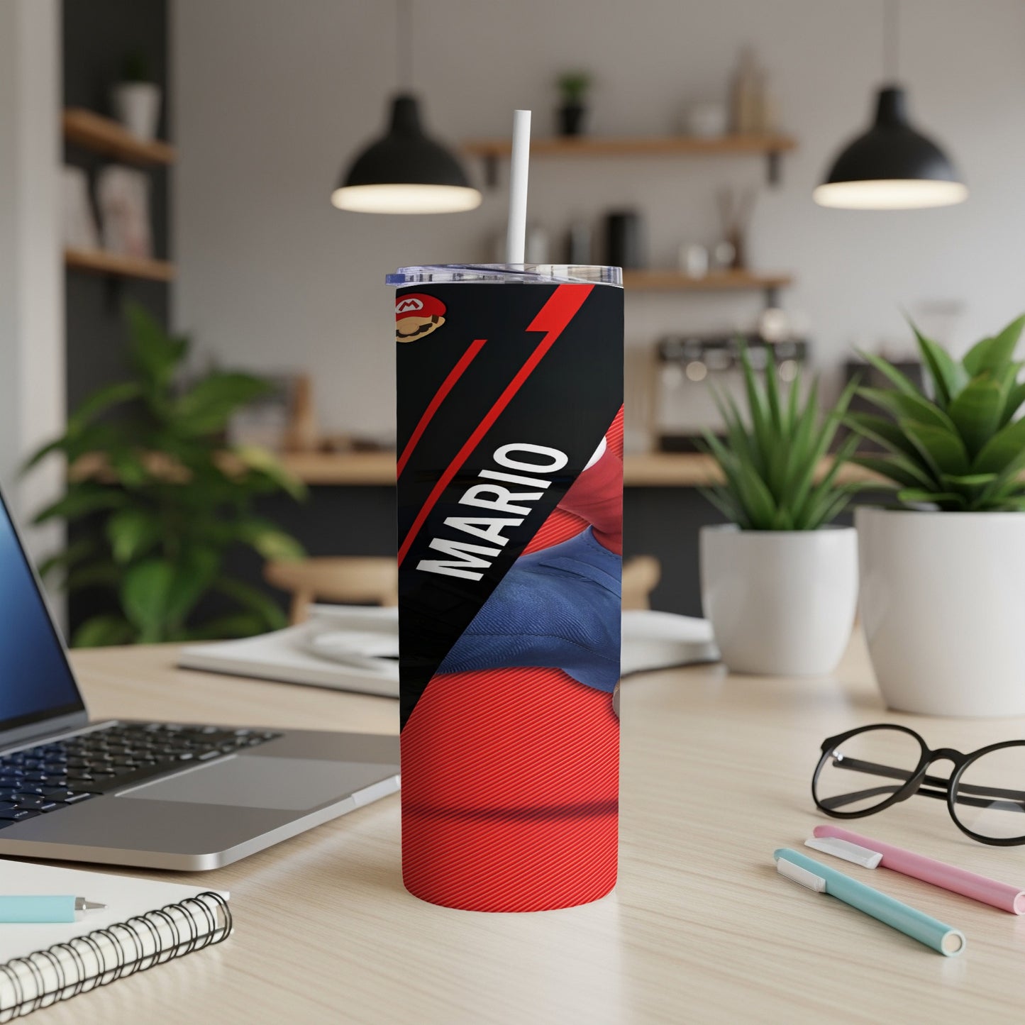 Red tumbler with Mario graphic and white straw on a desk.