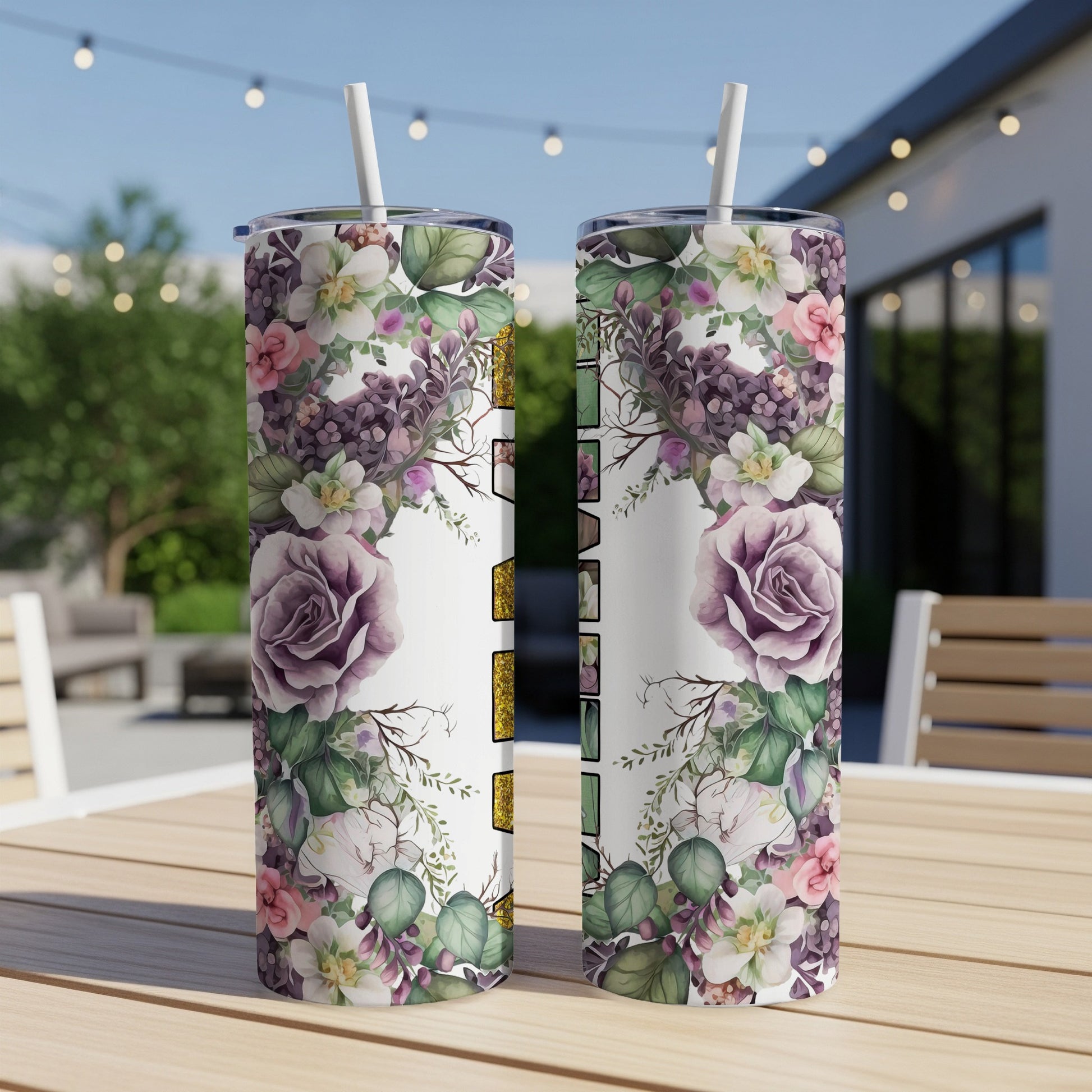 Two tumblers with floral designs and "MAMA" text, on a patio table.