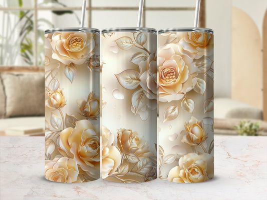 Three tumblers with golden roses and leaves, set against a blurred background.