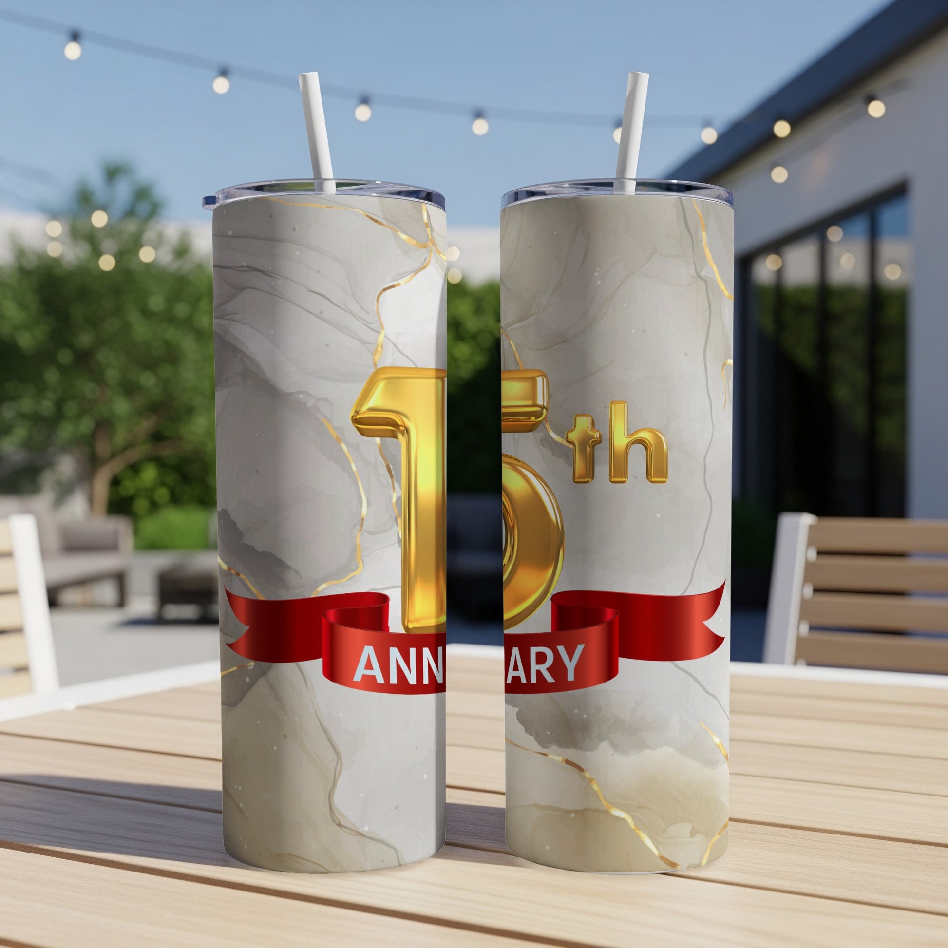 Gold "15th Anniversary" text on marbled tumblers with red ribbon.