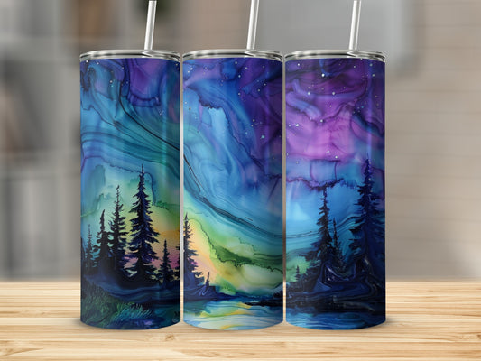 Three tumblers with a vibrant night sky and silhouetted pine trees.