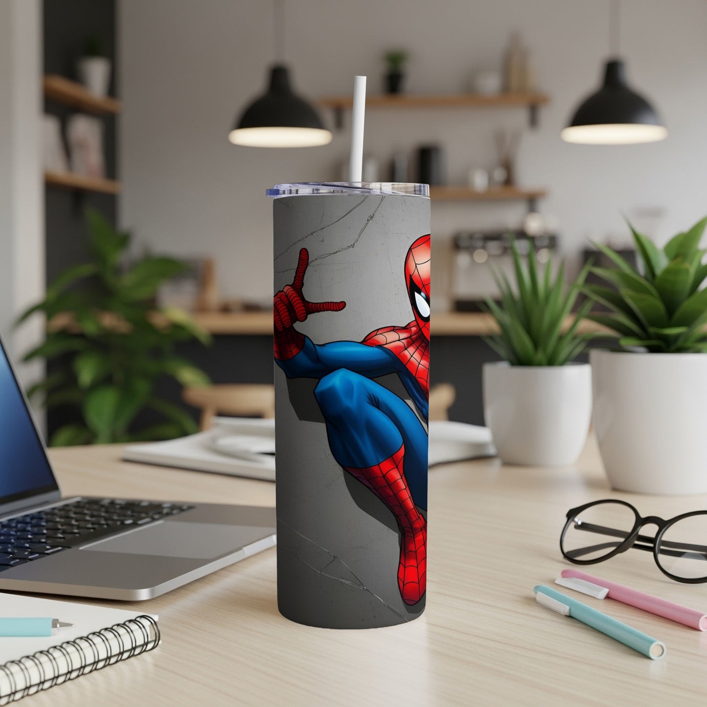 Spider-Man clinging to a textured wall on a stainless steel tumbler.