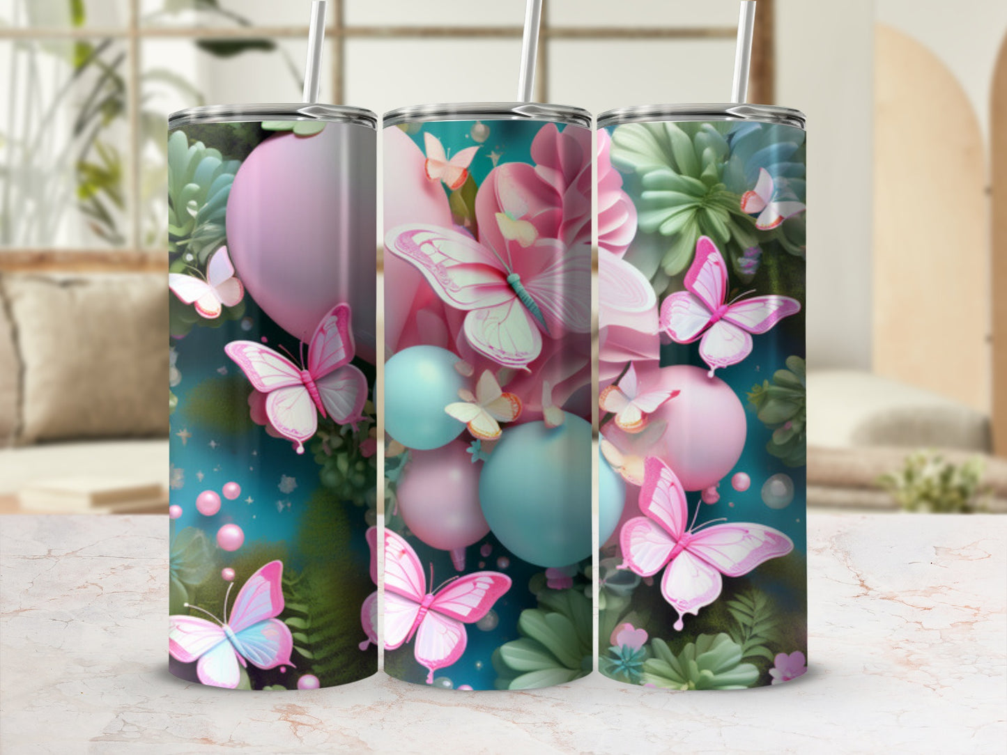 Three tumblers with butterflies and floral patterns in pink, blue, and green.