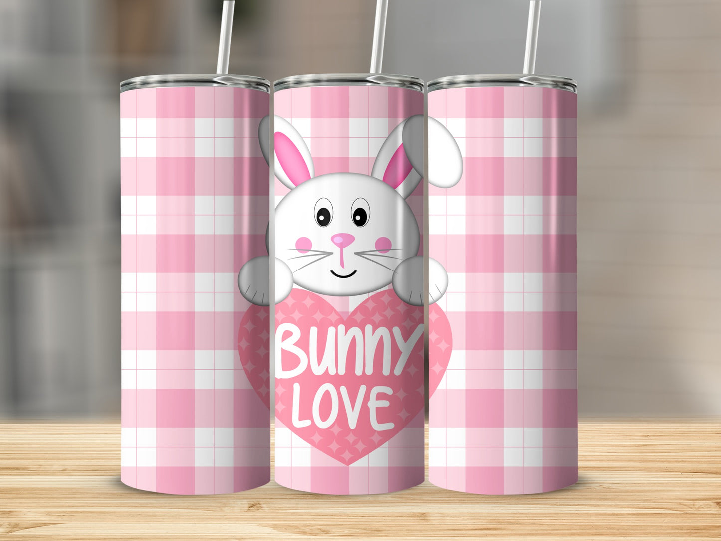 Pink gingham pattern tumbler with a cartoon bunny holding a heart that says "Bunny Love."