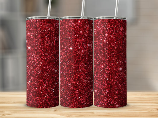 Three tall tumblers with red glitter, a straw in each.