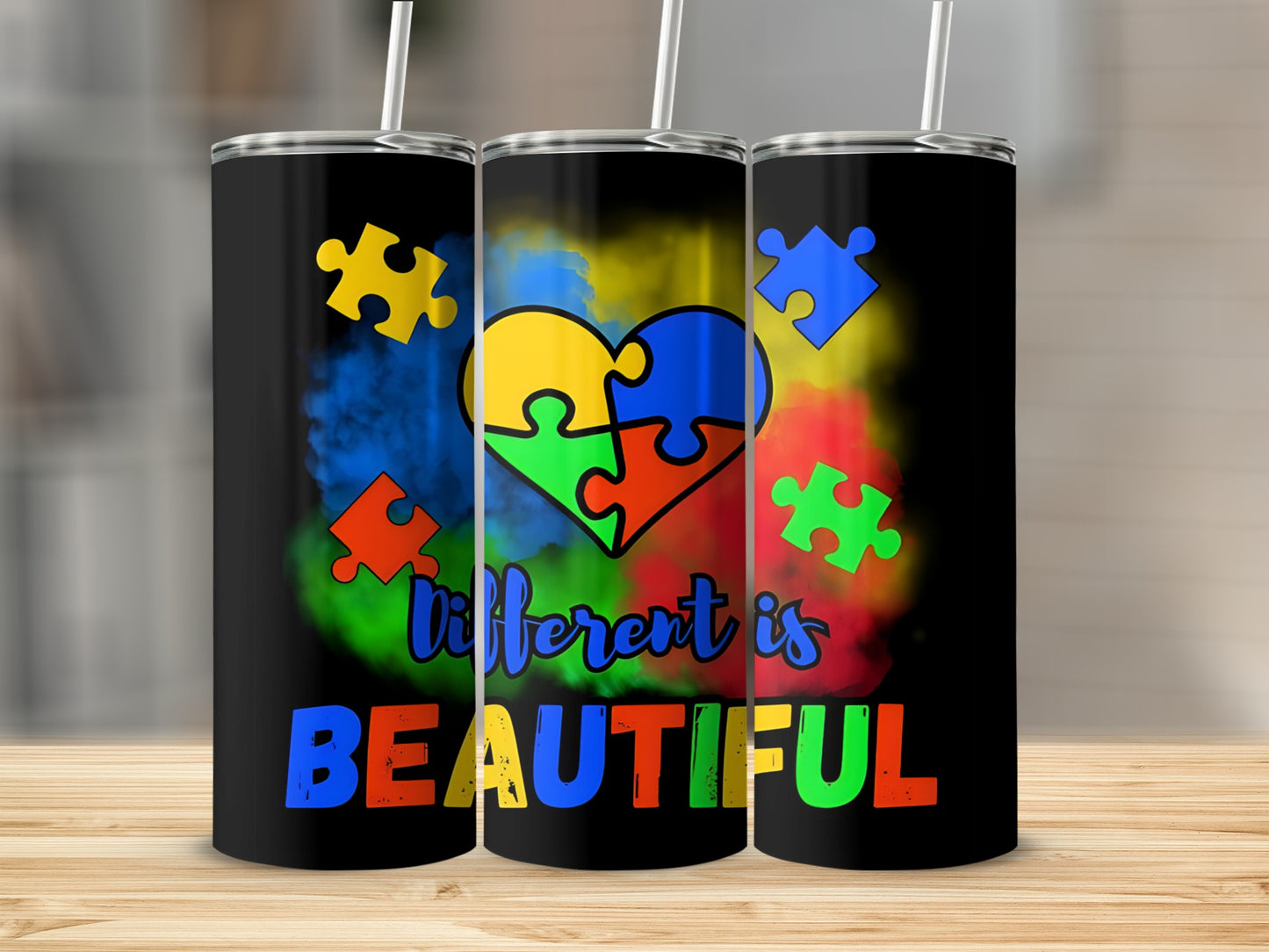 Black tumbler with colorful puzzle heart and "different is BEAUTIFUL" text.