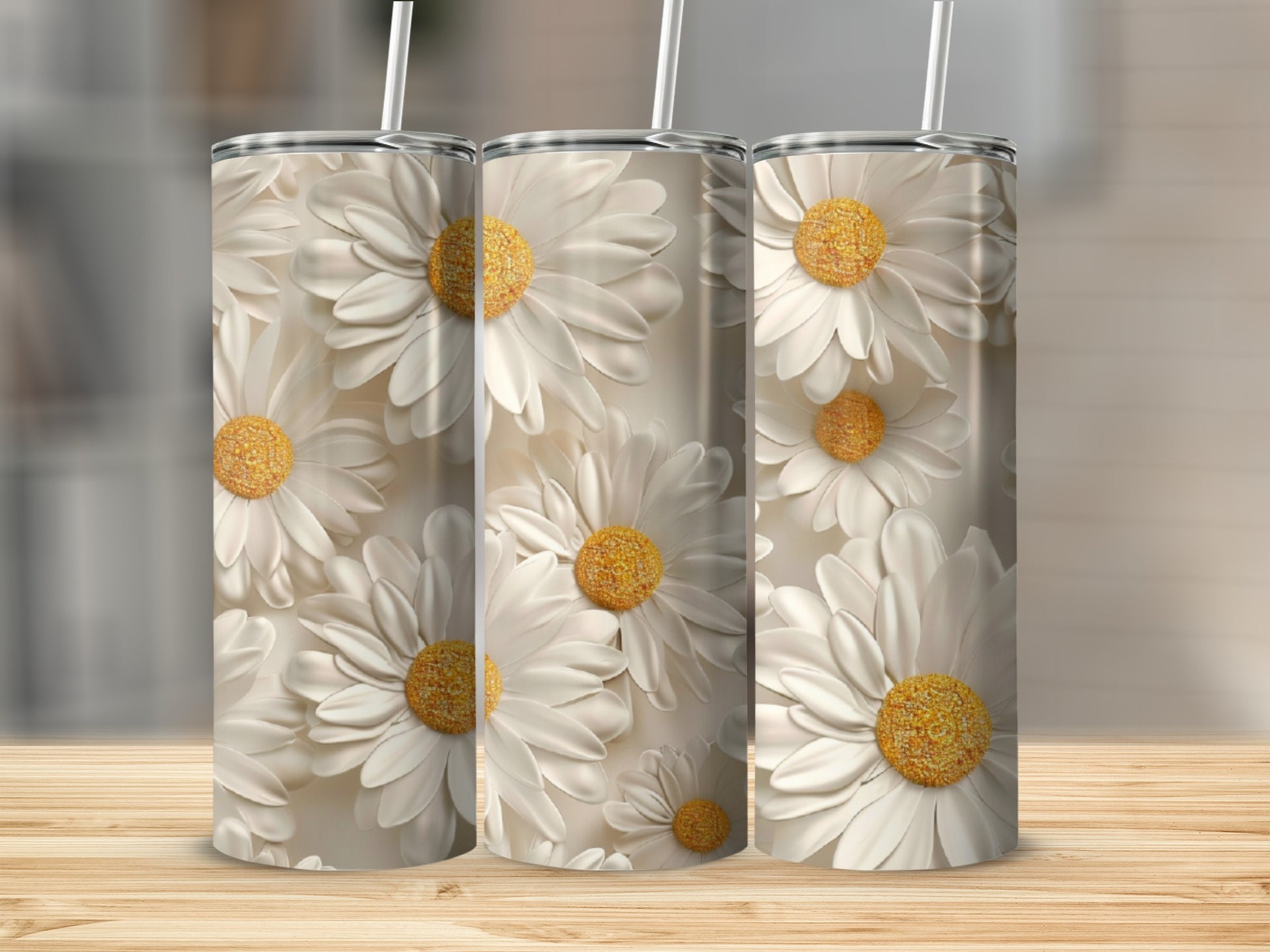 Three tumblers with a detailed daisy floral pattern.