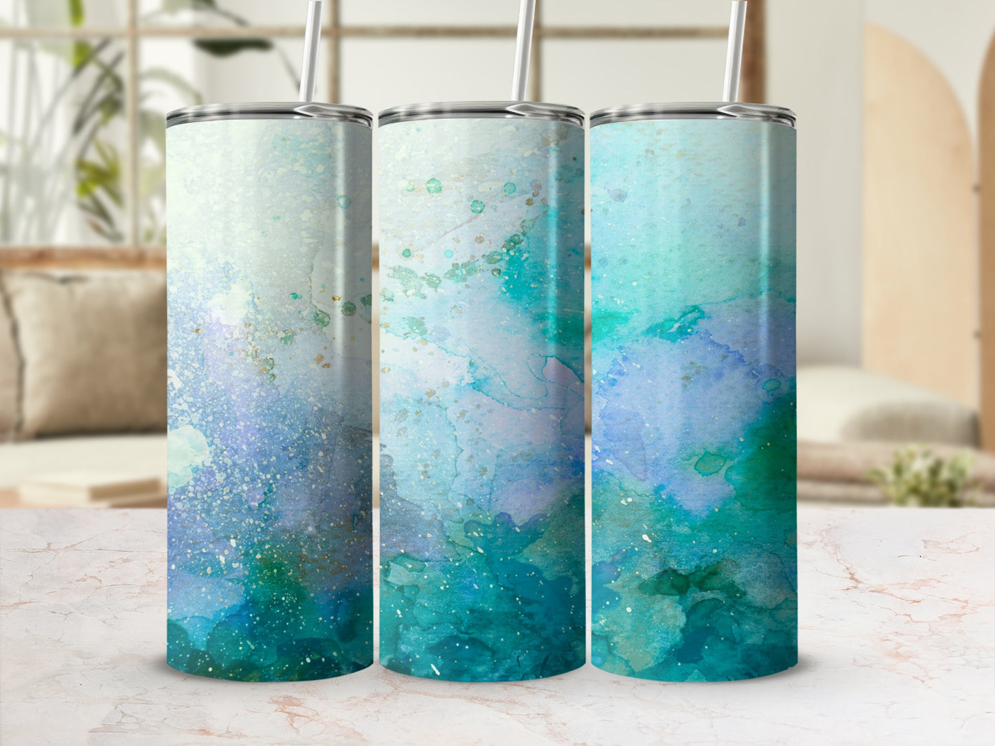 Three tumblers with blue and green watercolor abstract designs.