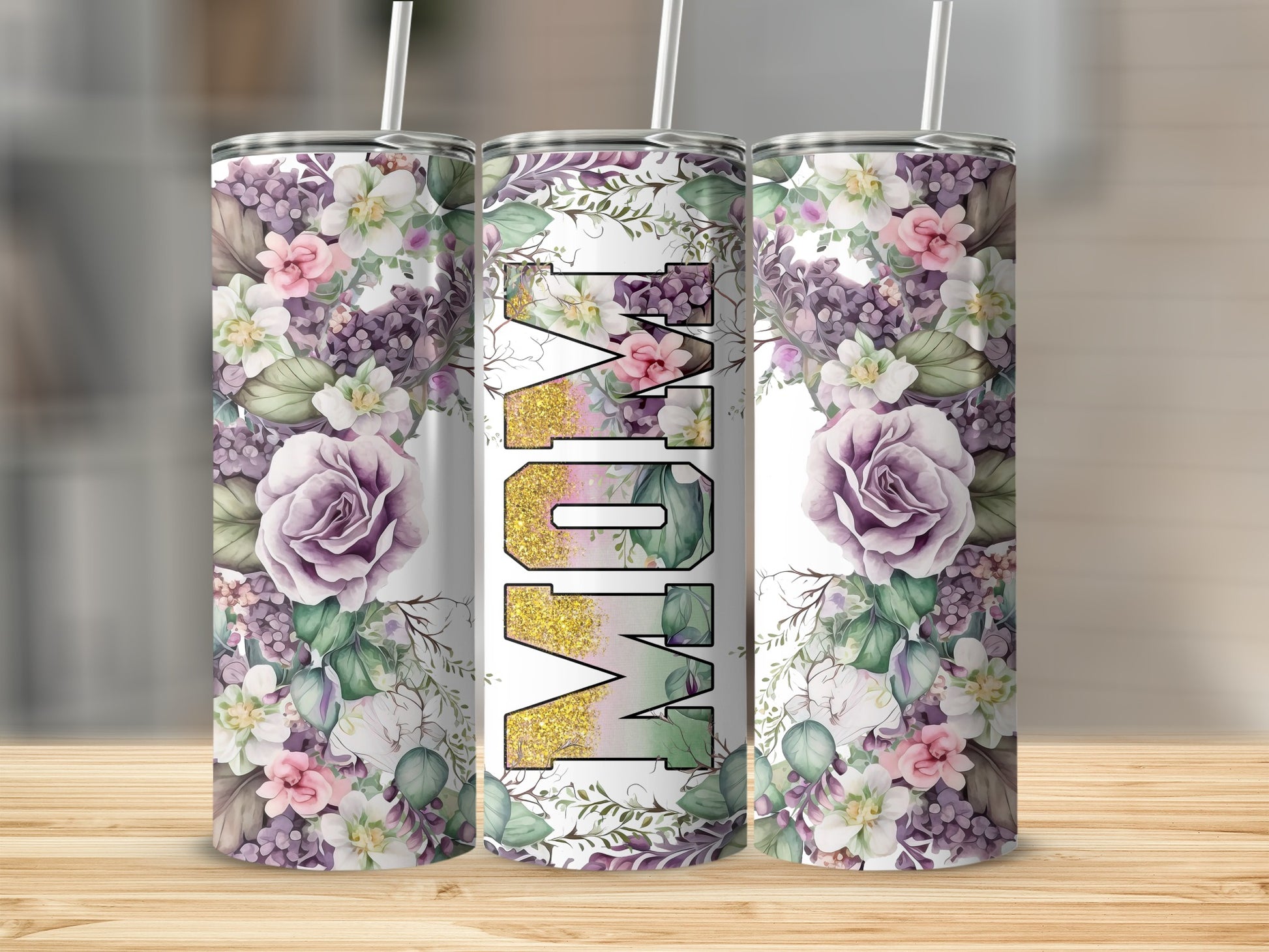 Floral tumbler with "Mom" in gold glitter lettering.