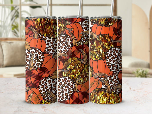 Three tumblers with pumpkin, leopard print, and plaid patterns.