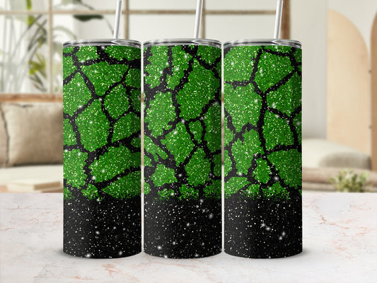 Green glitter tumbler with black speckled bottom.