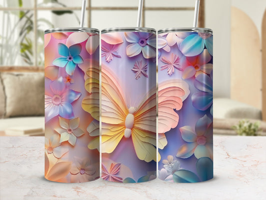 Tapered tumblers with pastel butterfly and floral designs, each with a straw.
