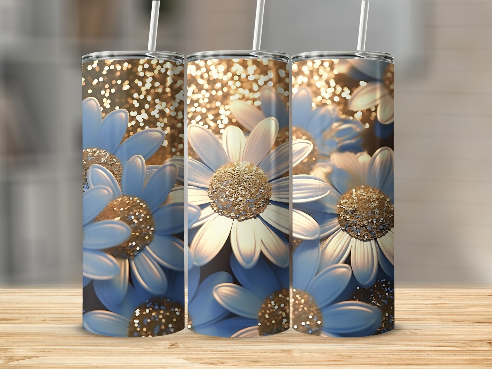 Three tumblers with blue and white daisies and gold glitter bokeh.