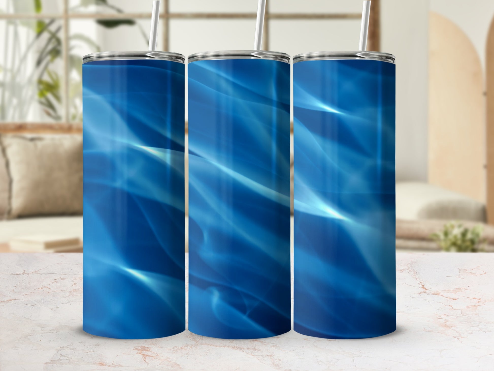Three blue abstract wave pattern tumblers with straws.