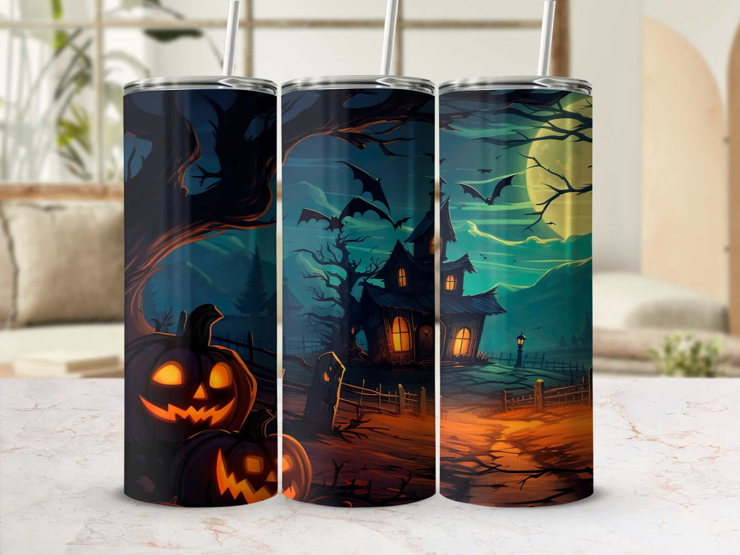 Tumblers with a spooky Halloween scene featuring jack-o'-lanterns, a haunted house, and bats.
