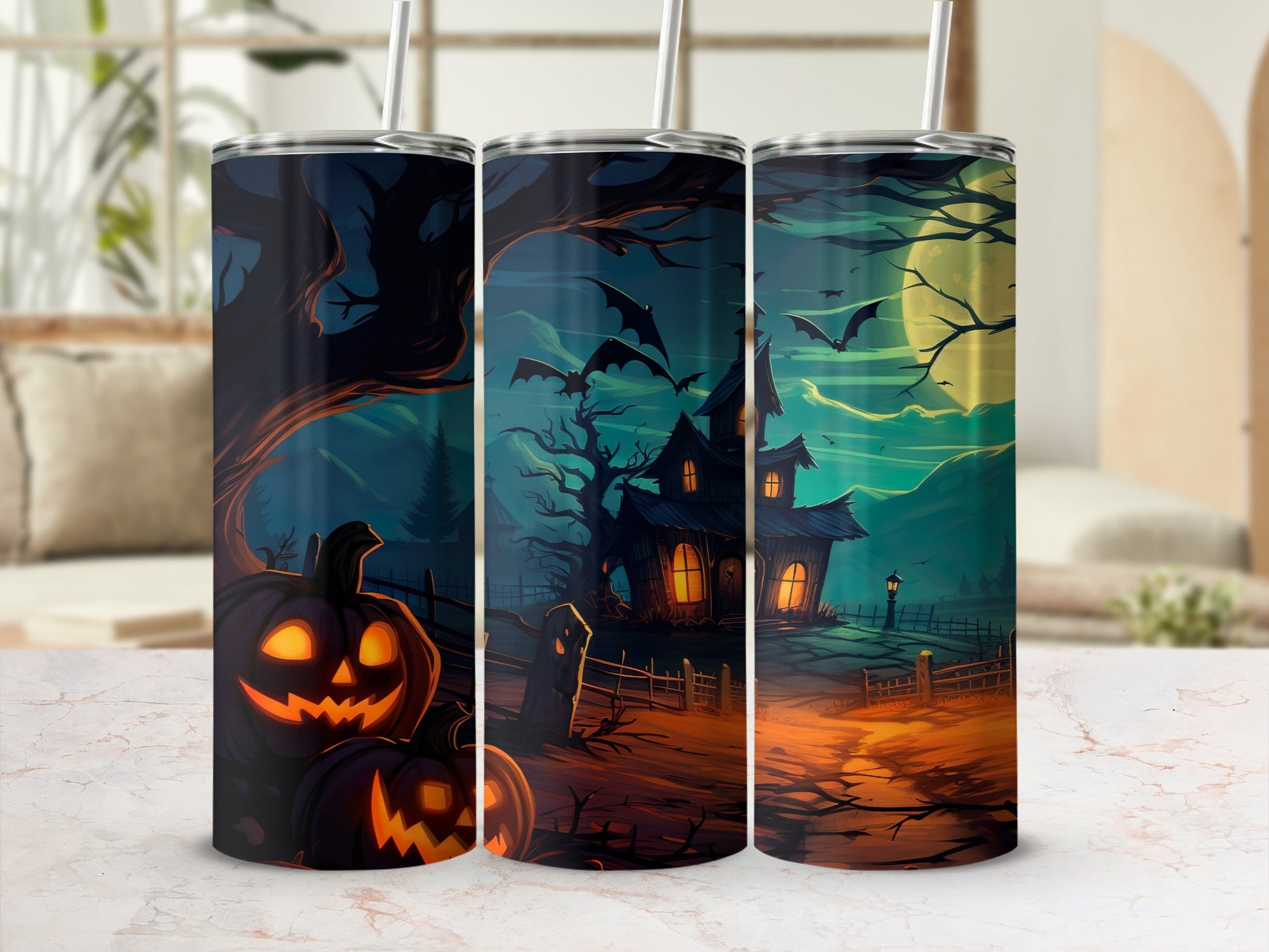 Tumblers with a spooky Halloween scene featuring jack-o'-lanterns, a haunted house, and bats.
