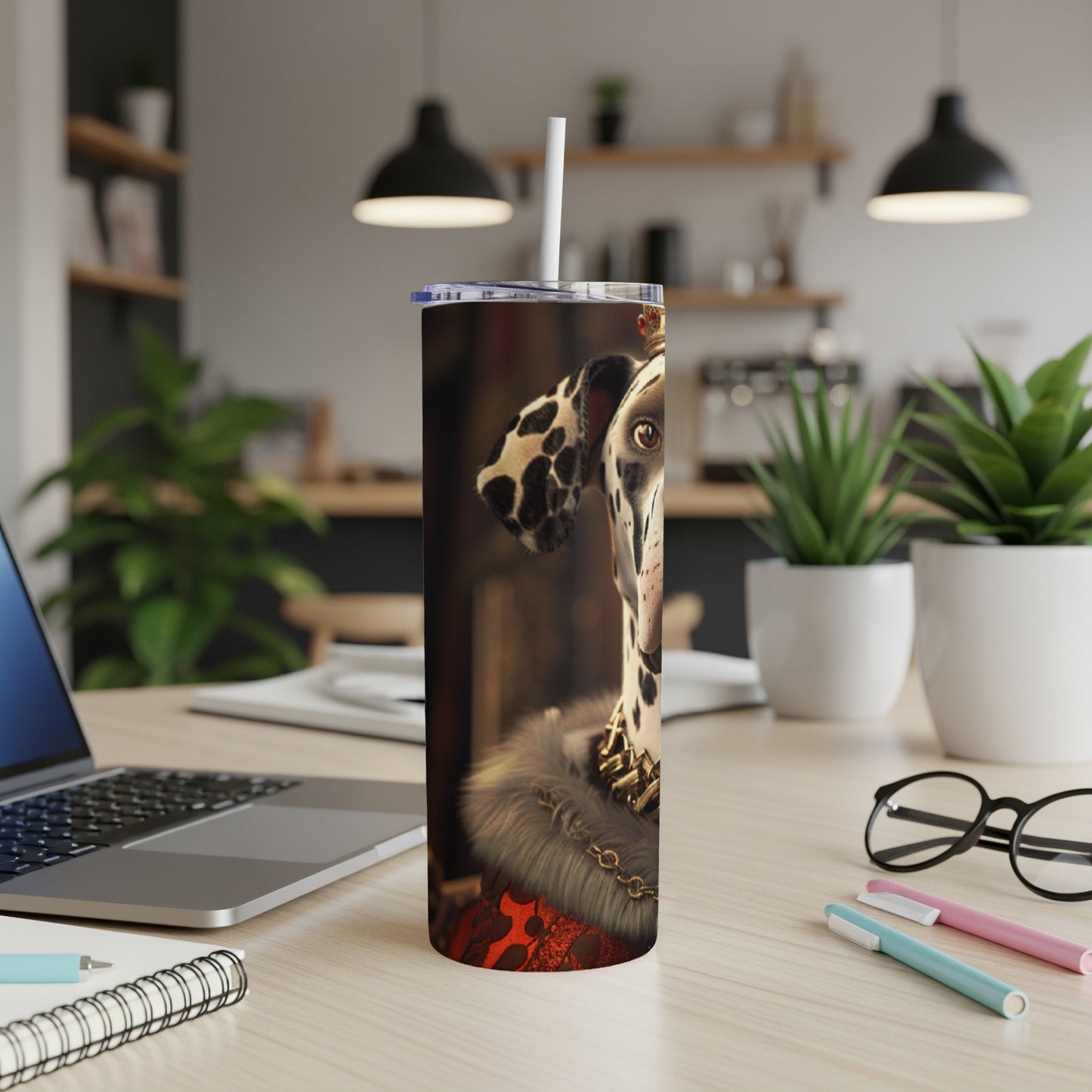 Dalmatian wearing a crown and fur collar on a tumbler.