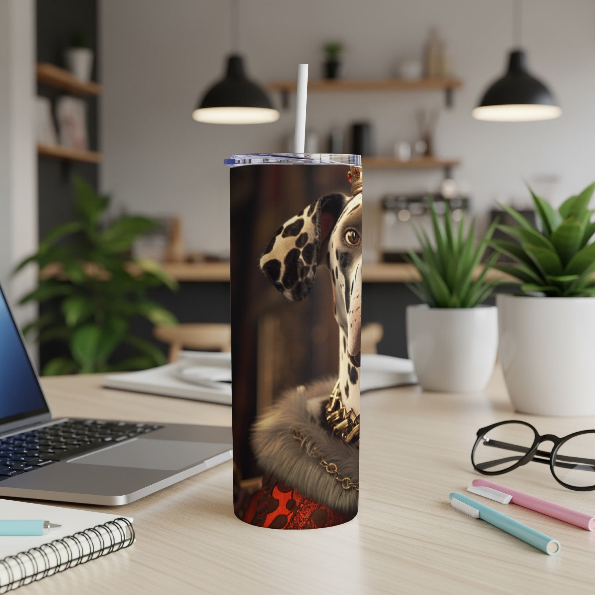 Dalmatian wearing a crown and fur collar on a tumbler.