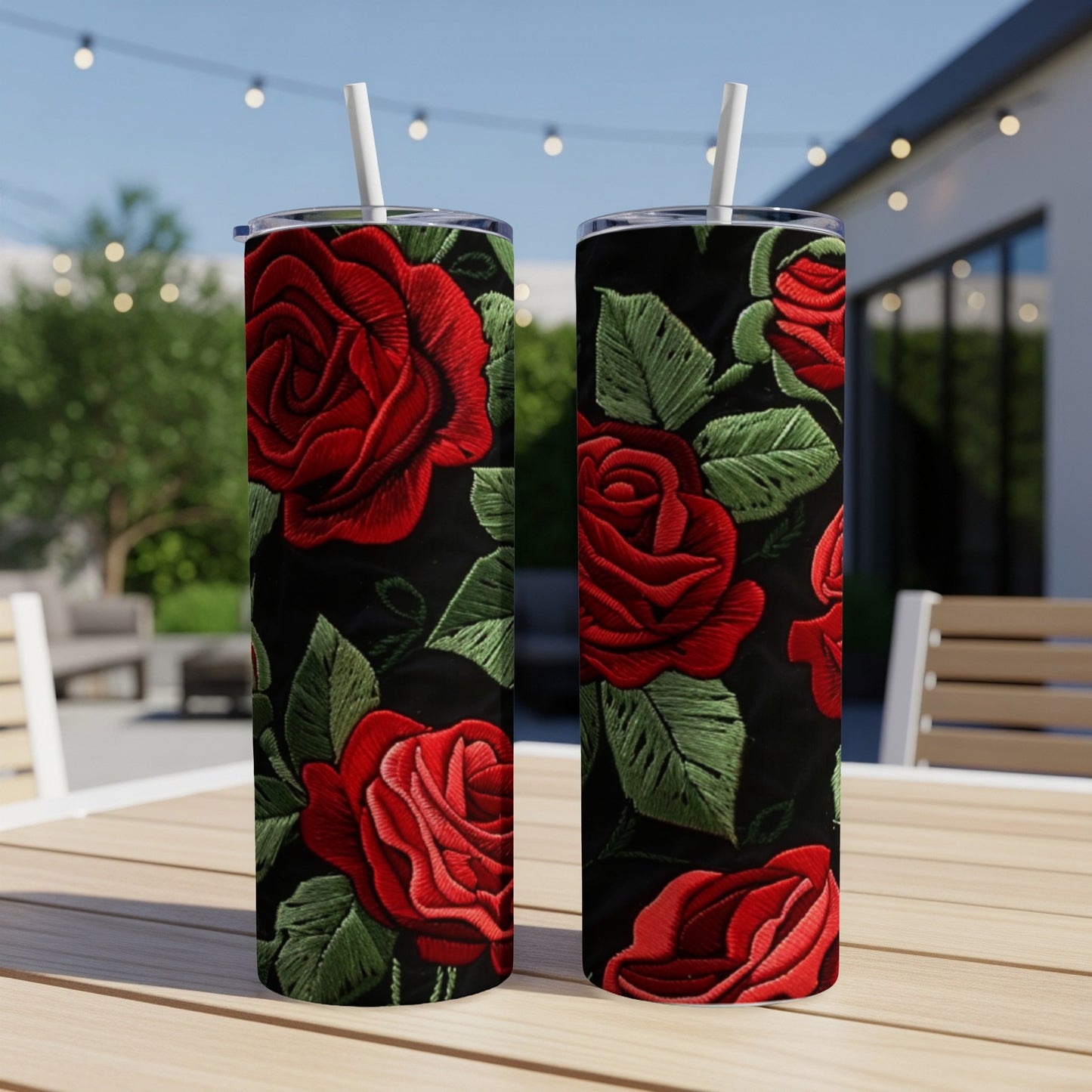 Two tumblers with embroidered red roses and green leaves pattern.