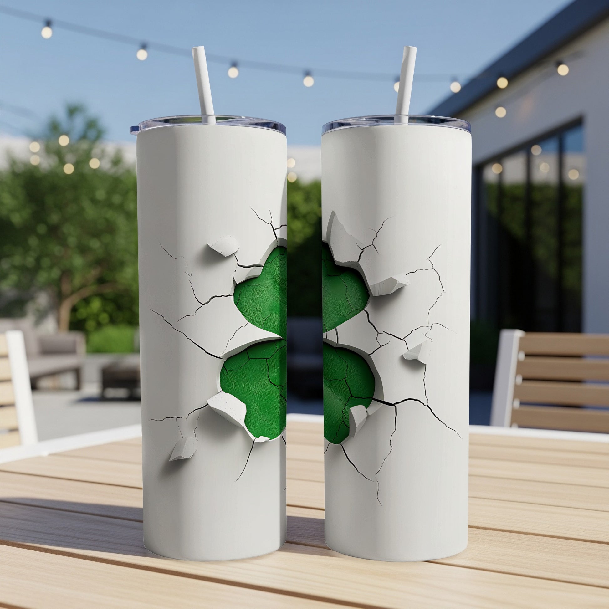 Two white tumblers with cracked surfaces revealing a green shamrock.