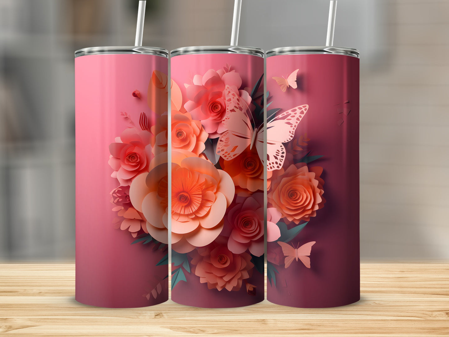 Three pink tumblers with floral and butterfly designs.