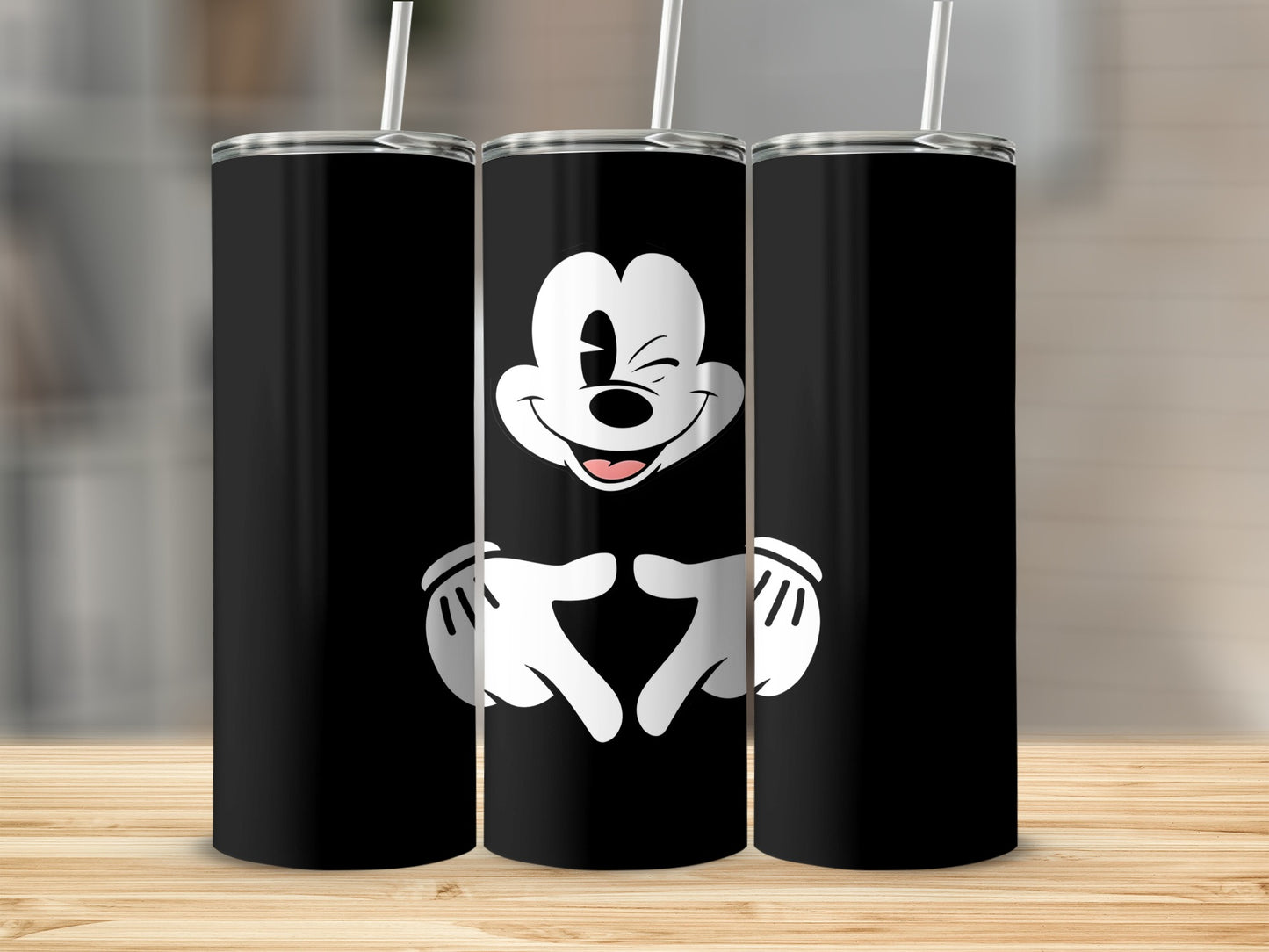 Black tumbler featuring Mickey Mouse making a heart shape with his hands.