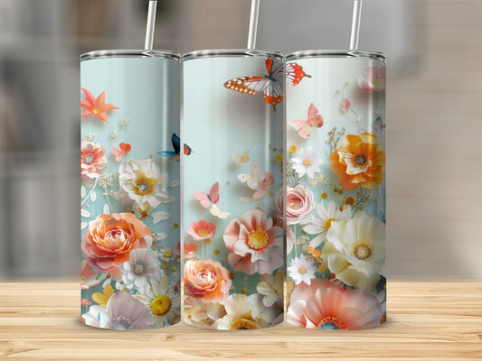 Three tall tumblers with a floral and butterfly design.