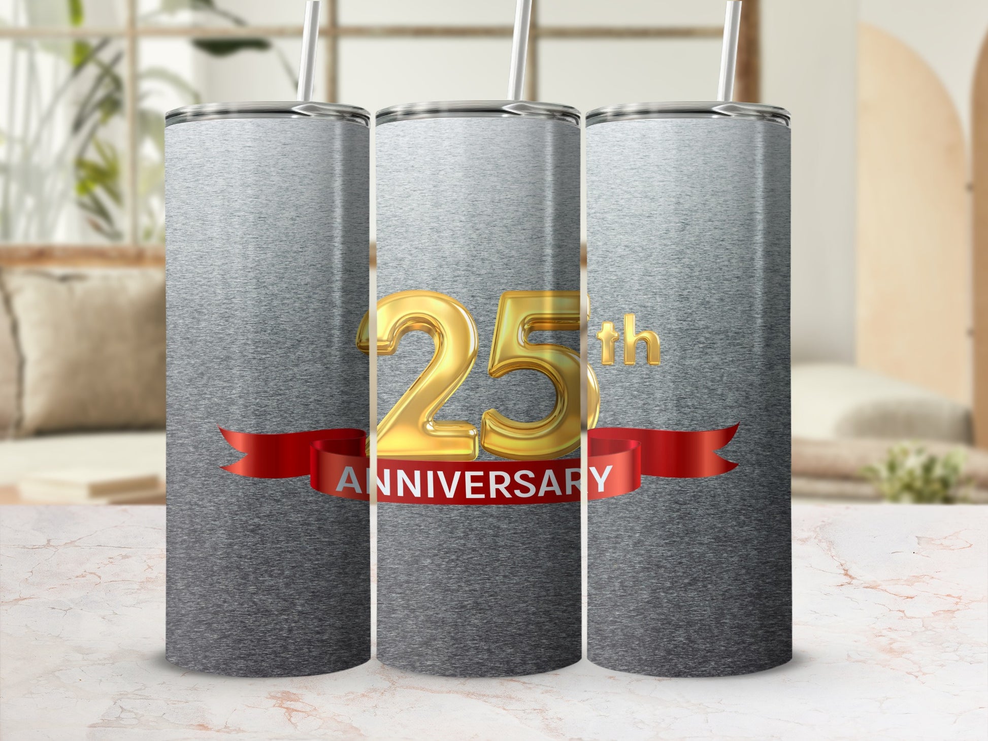 Gold "25th Anniversary" text on red ribbon with three tumblers.
