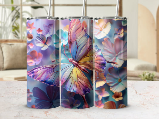 Three tumblers with colorful butterfly and floral designs displayed in a home setting.
