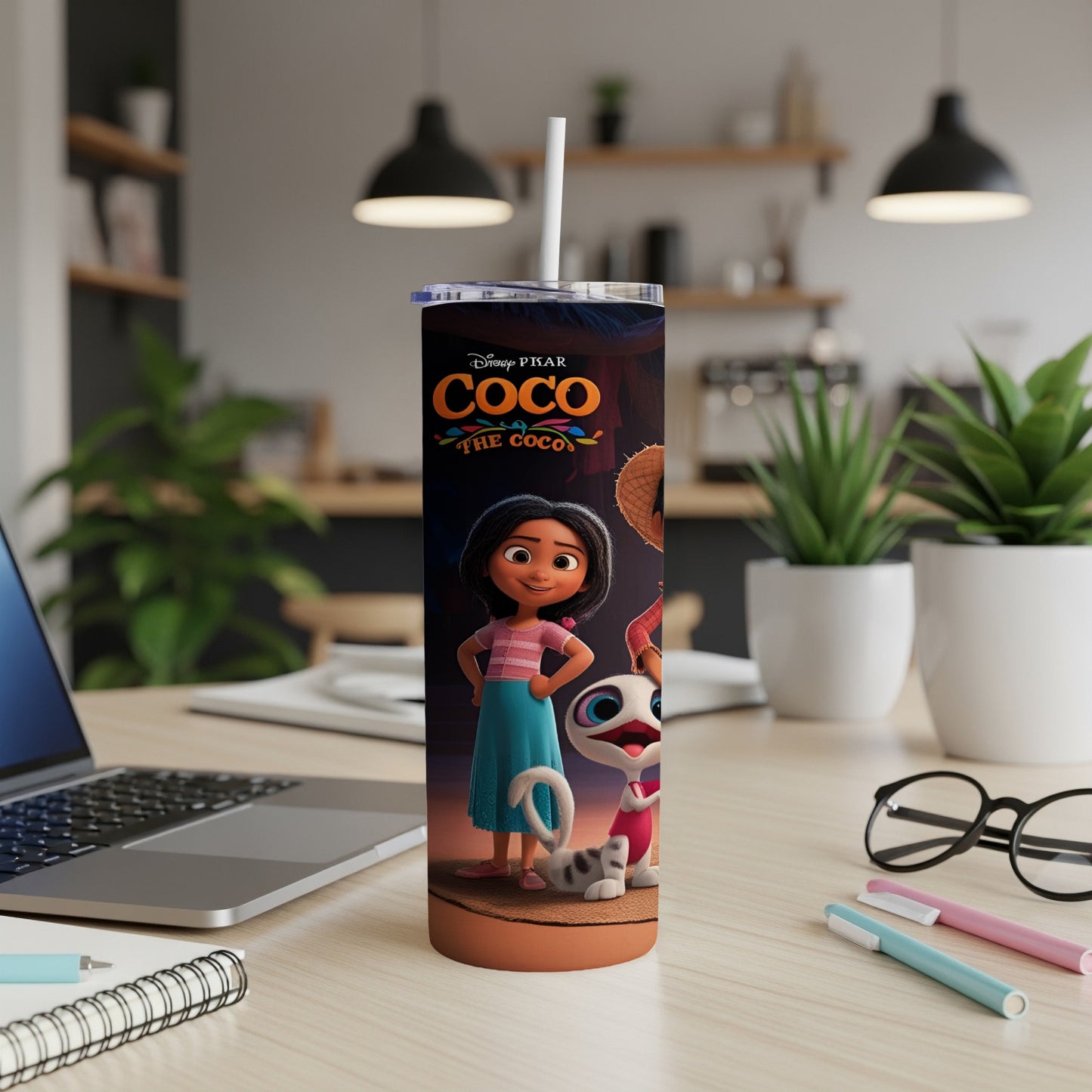 Coco The Coco tumbler with Miguel and Dante on a desk.