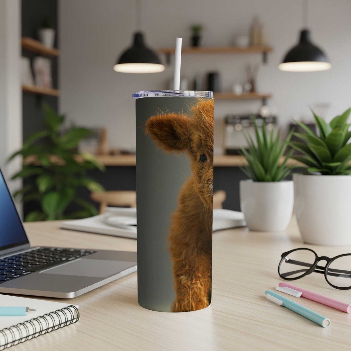 Fluffy brown cow on a tumbler.