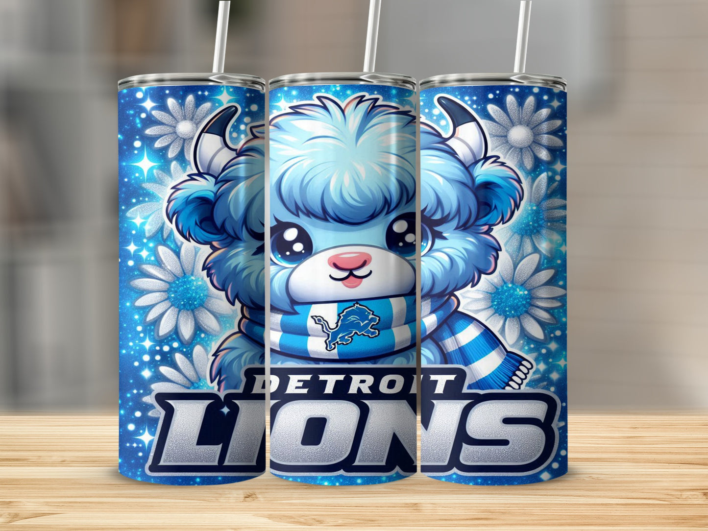 Blue cartoon lion mascot with Detroit Lions scarf and snowflakes on tumbler.