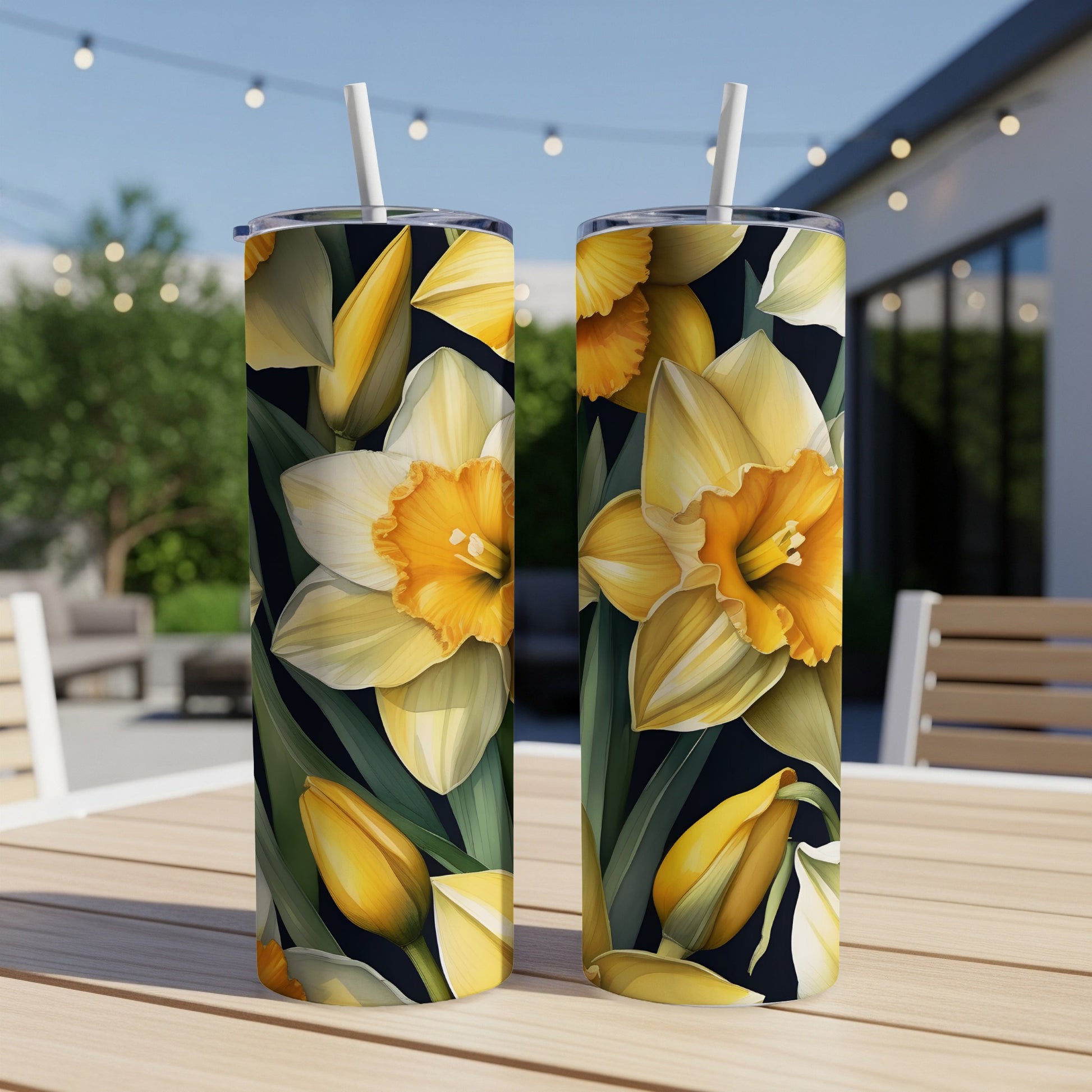 Two tumblers with a yellow and white daffodil floral pattern.