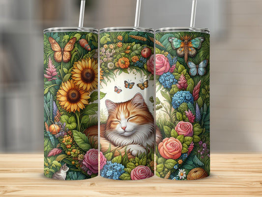 Orange tabby cat sleeping amidst sunflowers, roses, and butterflies on a tumbler.