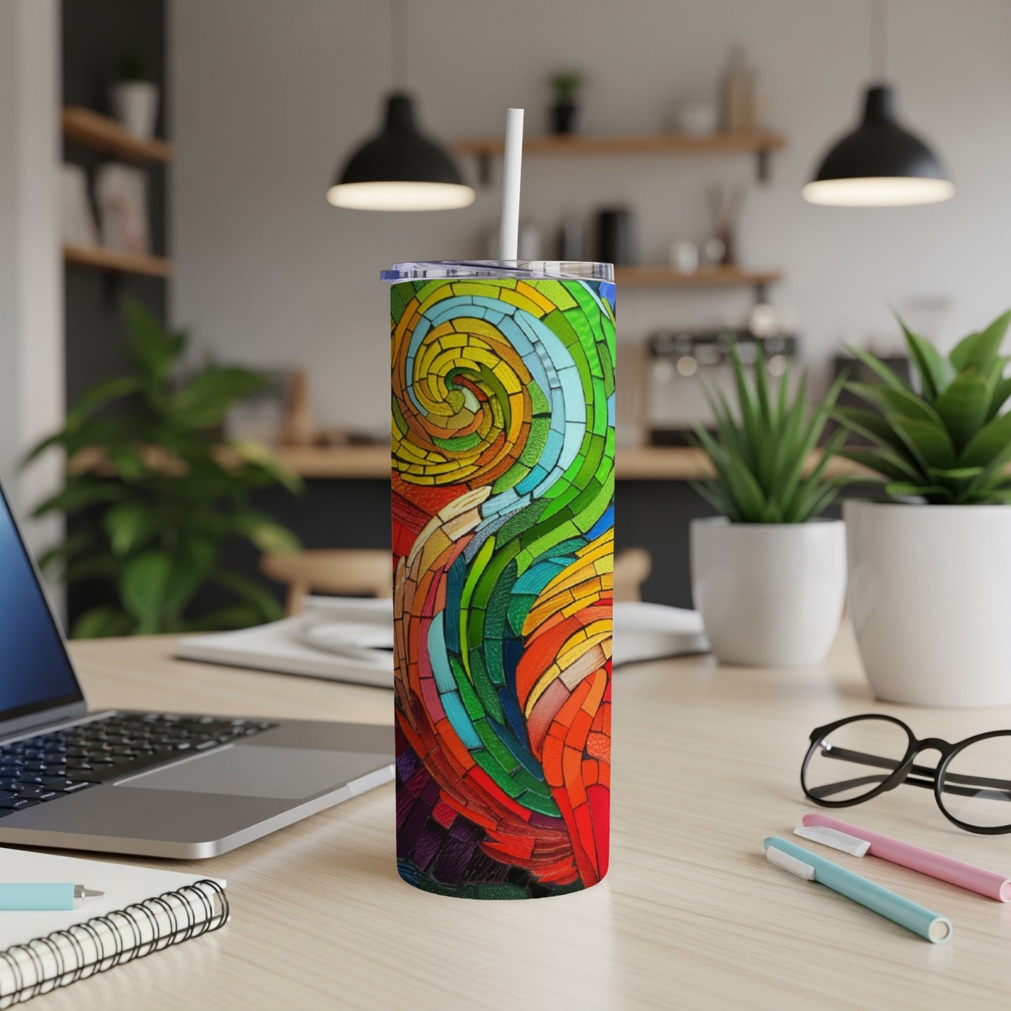 Colorful abstract stained glass pattern on a slim tumbler with a straw.
